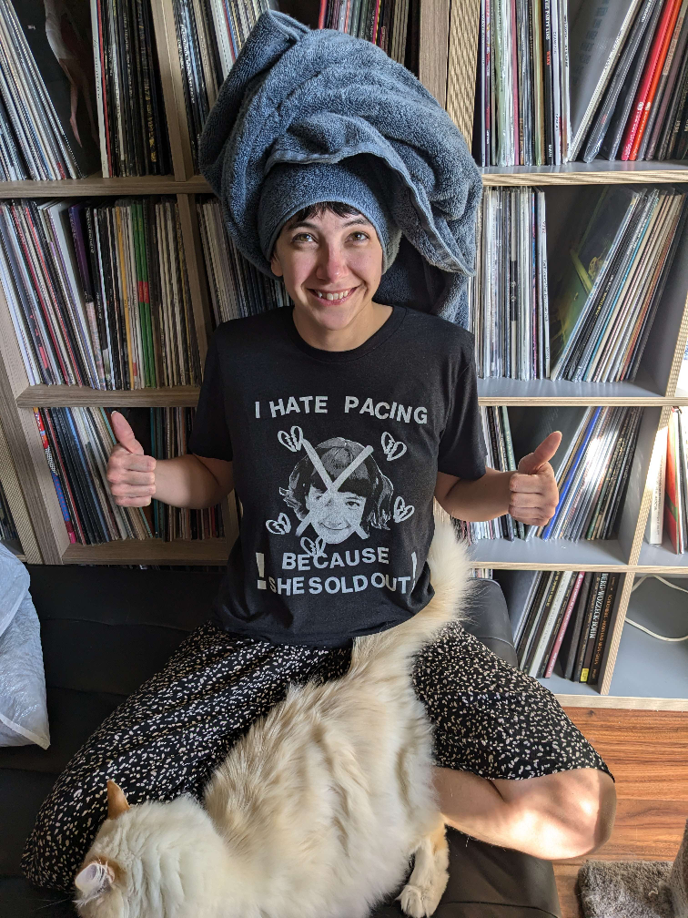 Katie of Pacing wearing the initial t-shirt print run giving two thumbs up.
